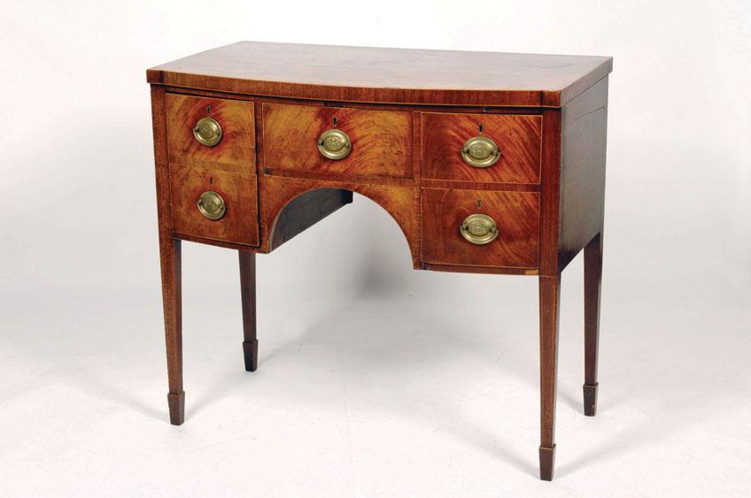 Appraisal: A GEORGE III MAHOGANY BOW FRONT SIDEBOARD the shaped top