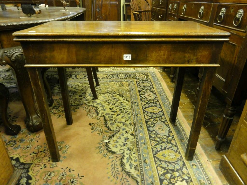 Appraisal: A Georgian mahogany fold over top tea table raised on