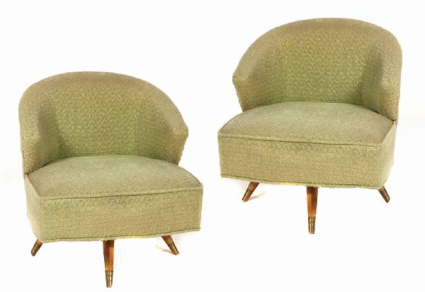 Appraisal: A pair of mid century upholstered swivel armchairs manufactured by