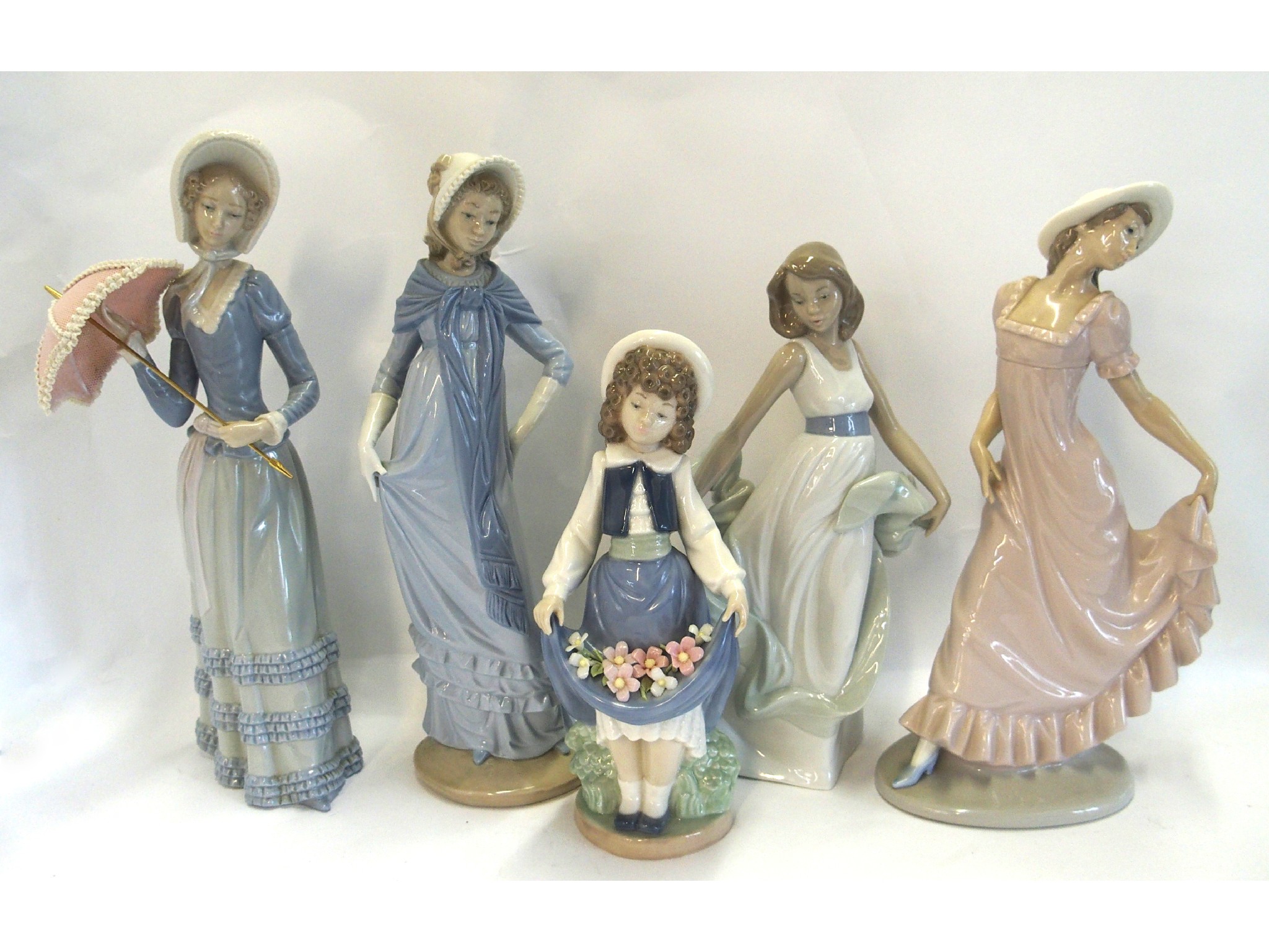 Appraisal: Five Nao figures of girls including one holding a parasol