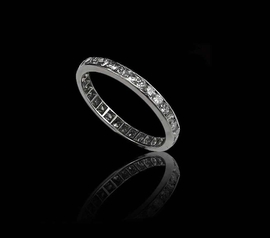 Appraisal: PLATINUM DIAMOND WEDDING ETERNITY BAND RING Platinum band of round