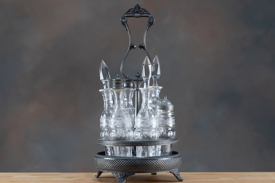 Appraisal: Silver and glass footed Cruet Set containing six bottles non-polished