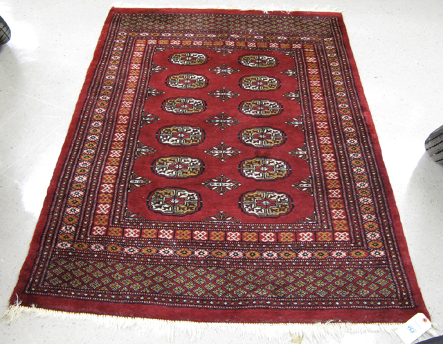 Appraisal: TWO HAND KNOTTED RED BOKHARA AREA RUGS ' x '