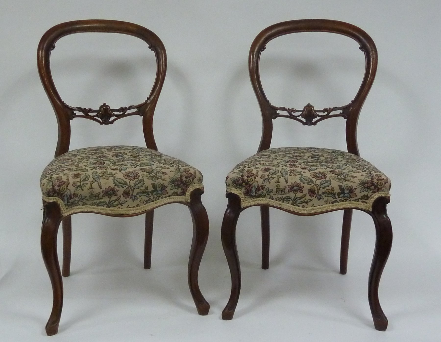 Appraisal: Four Victorian walnut dining chairs with carved horizontal splats to