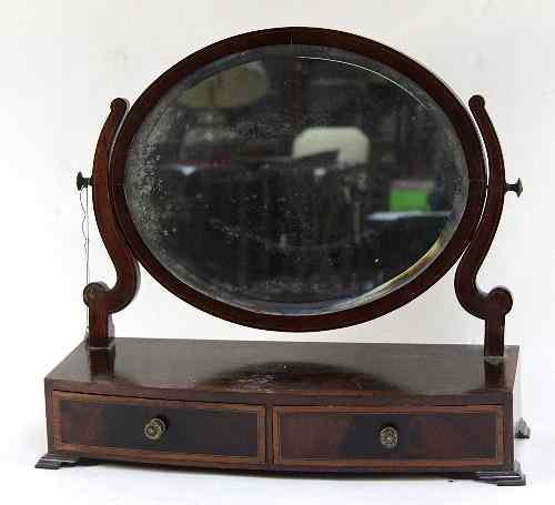 Appraisal: A mahogany framed dressing table mirror the oval glass above