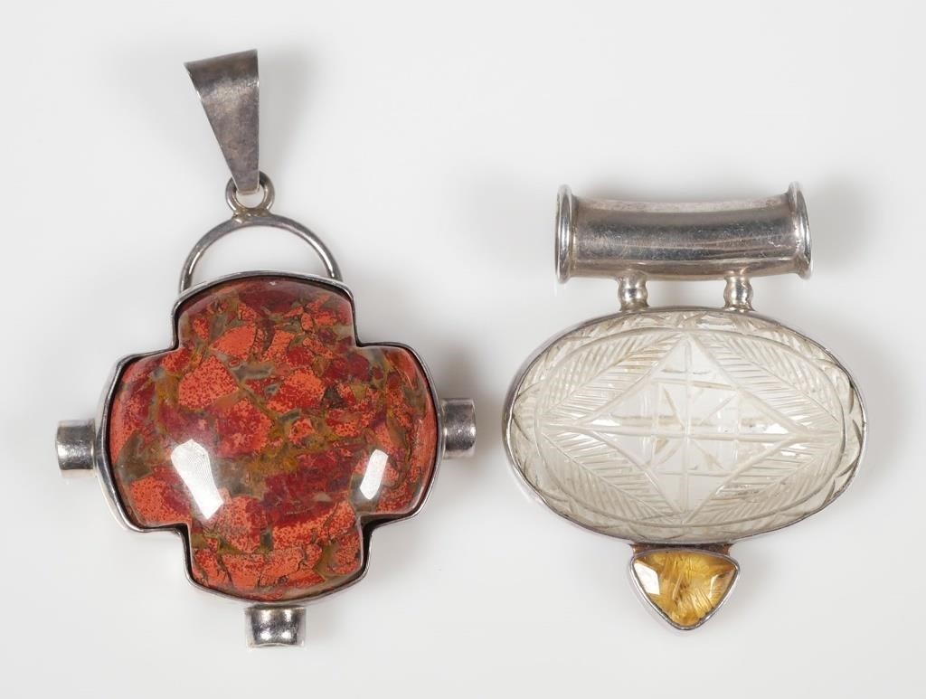 Appraisal: Two pendants one with polished stone and the other with