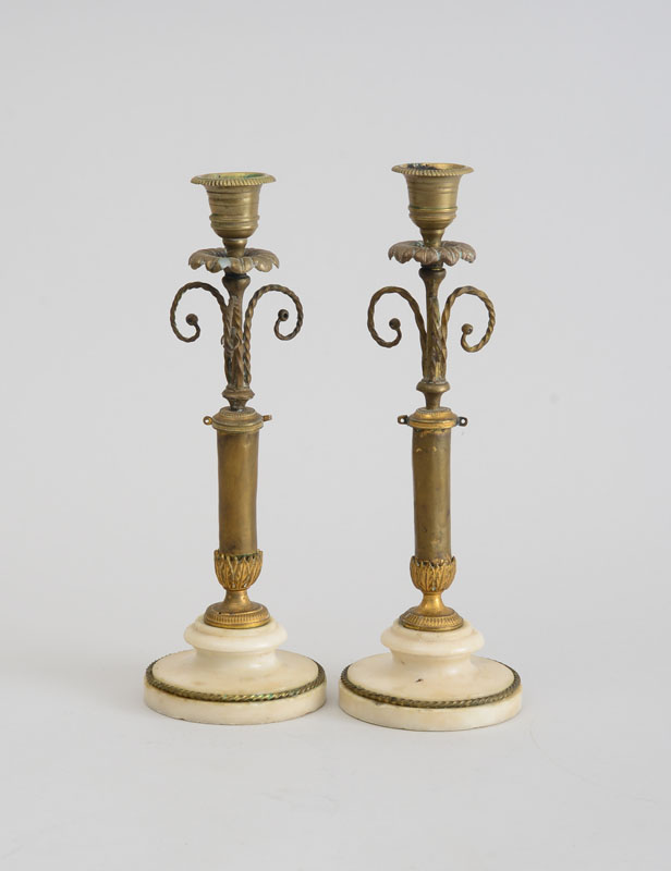 Appraisal: PAIR OF FRENCH GILT-METAL AND MARBLE CANDLESTICKS Each column stem