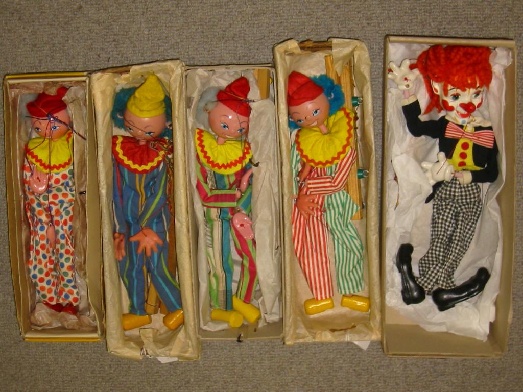 Appraisal: Five Pelham puppets comprising SS Clown yellow box three SS