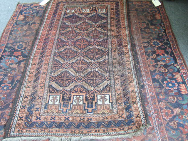 Appraisal: A Beluchistan rug the indigo field with leaf trellis bearing