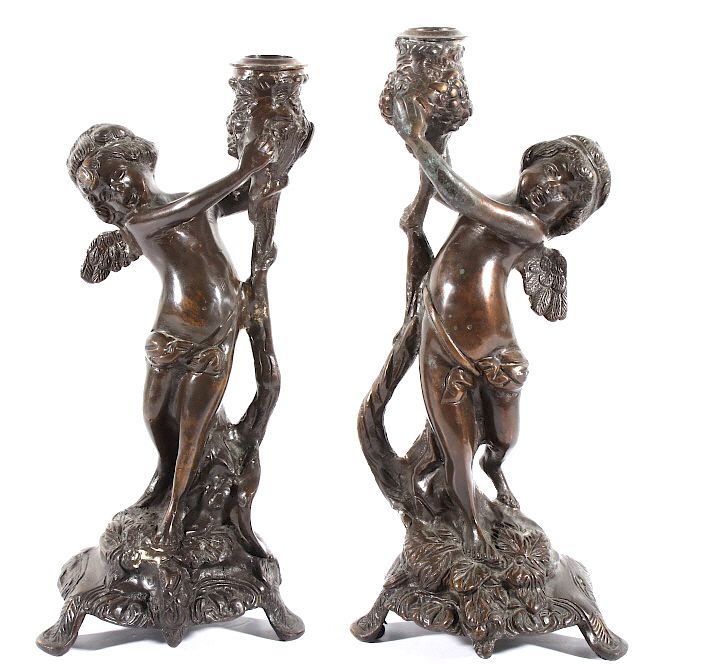 Appraisal: Early Pair of Bronze Cherub Candle Holders Featured in this