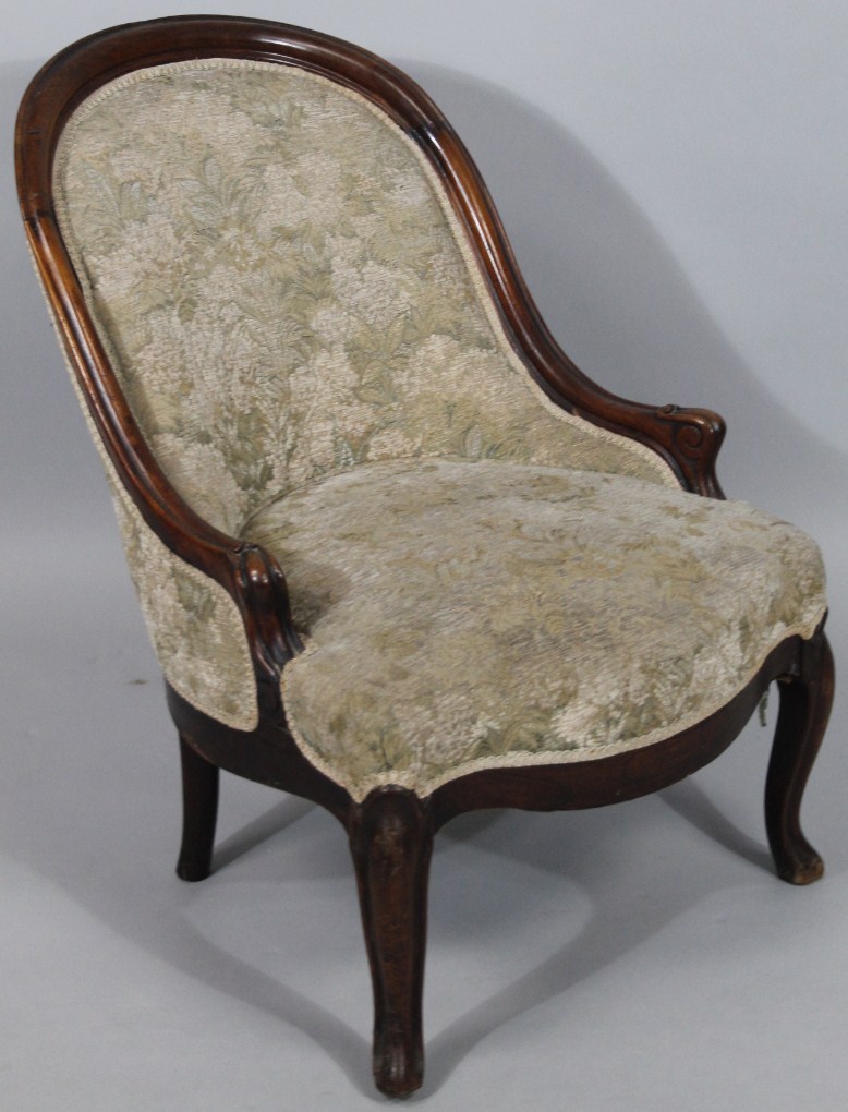 Appraisal: A thC walnut framed open tub chair upholstered in floral