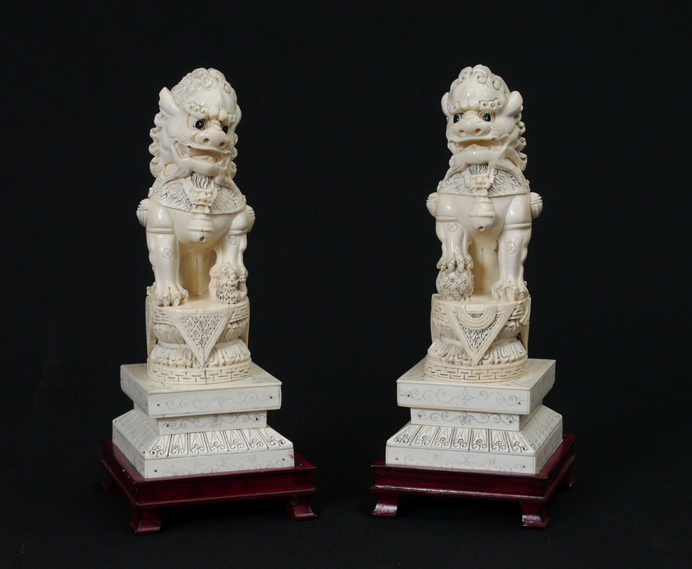 Appraisal: PAIR CARVED IVORY PALACE GUARD FOO LIONS Each signed on