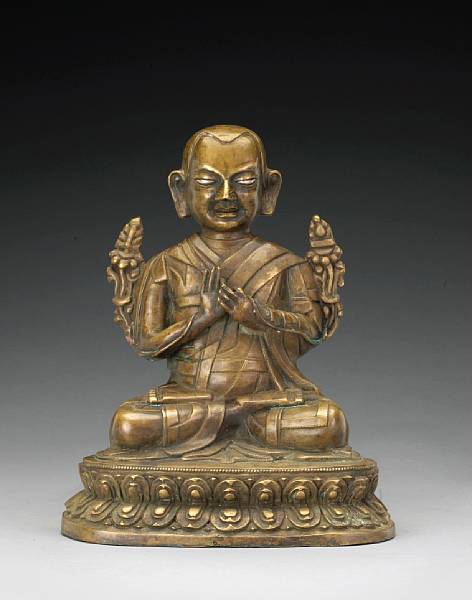 Appraisal: A Tibetan bronze seated lama th th Century The figure