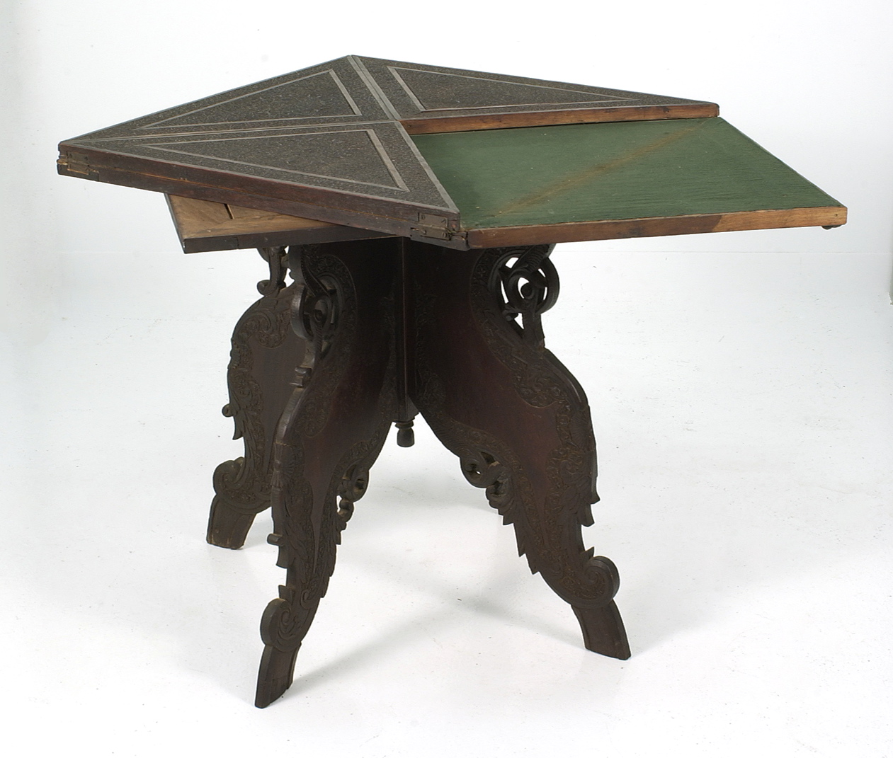 Appraisal: PERSIAN OR ANGLO-INDIAN HARDWOOD GAMING TABLE th CenturyWith handkerchief-style folding