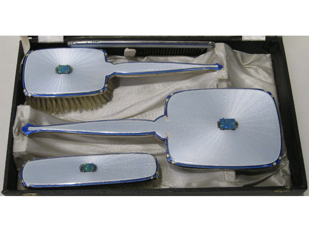 Appraisal: Cased four piece silver mounted and enamel dressing table set