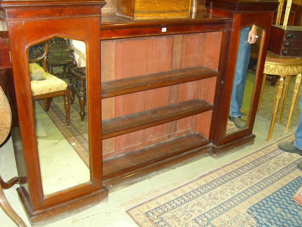 Appraisal: A Victorian mahogany bookcase the centre section fitted with two