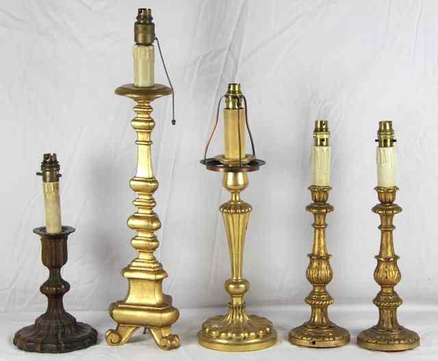 Appraisal: A gilt wood candlestick-type reading lamp of triangular tapering form