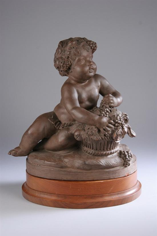 Appraisal: ITALIAN TERRA COTTA FIGURE OF PUTTO th century Holding basket