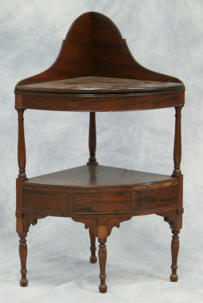 Appraisal: American mahogany Sheraton corner washstand high dovetailed splash back removable