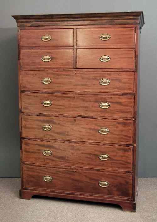 Appraisal: A late Georgian mahogany tallboy millinery cabinet the drawer fronts