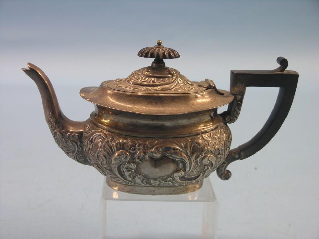 Appraisal: An Edward VII silver bachelor teapot embossed with leaf scrolls