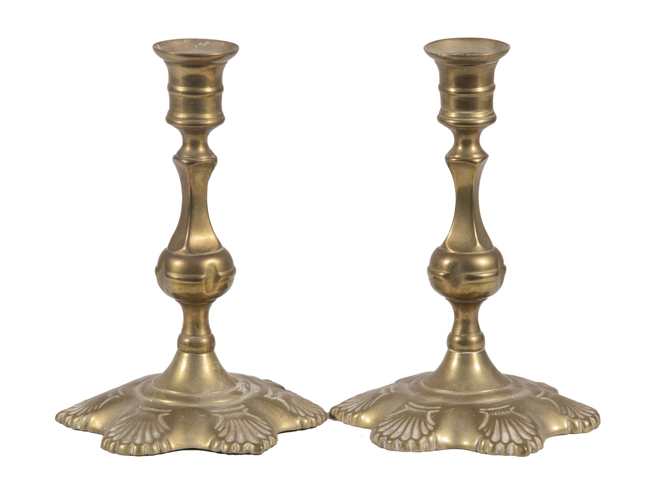 Appraisal: PR TH C BRASS SHELL-BASE CANDLESTICKS Pair of English Georgian