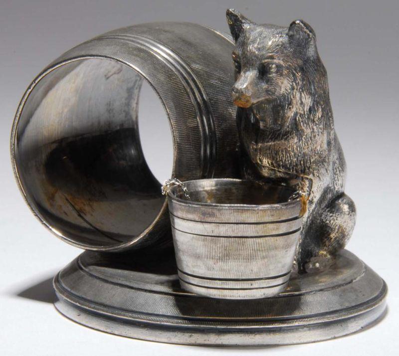 Appraisal: Dog with Bucket Figural Napkin Ring Description Dog with a