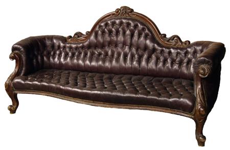 Appraisal: A mid Victorian period walnut and buttoned leather settee the