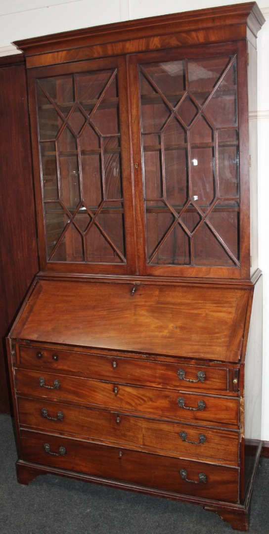 Appraisal: A George III mahogany bureau bookcase the upper section with