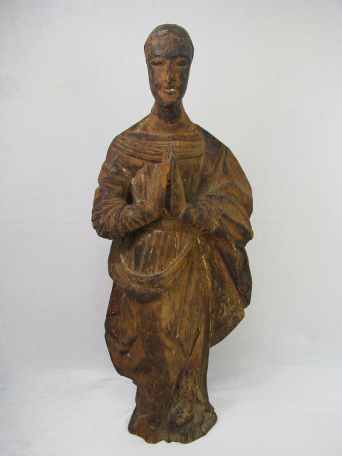 Appraisal: Statue of a carved wooden santos Measures high by wide