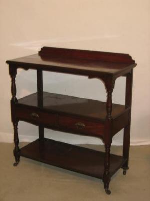 Appraisal: A VICTORIAN MAHOGANY BUFFET of three tier oblong form on