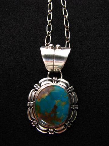 Appraisal: A Navajo sterling and turquoise pendant signed verso by B