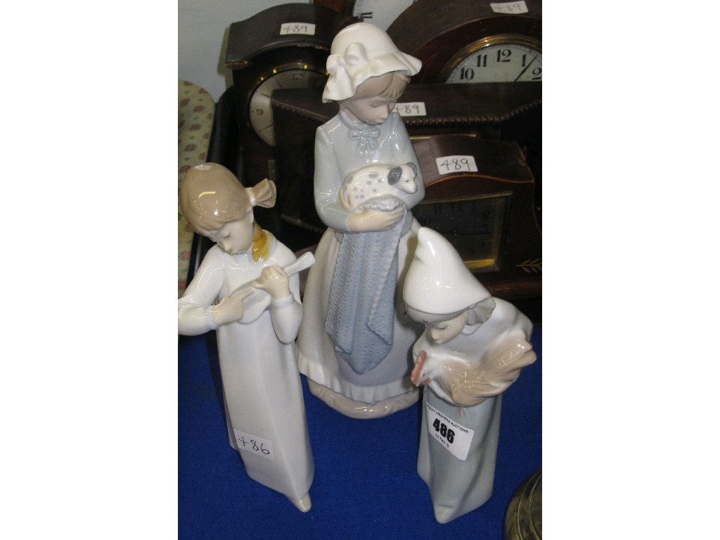 Appraisal: Lot comprising a Lladro figure and two Nao figures of