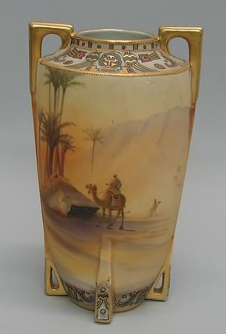 Appraisal: Featuring camel and rider raised enamel and gilt t porcelain