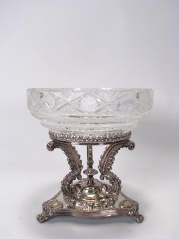 Appraisal: Cut and pressed glass pedestal bowl on ornate silver plate