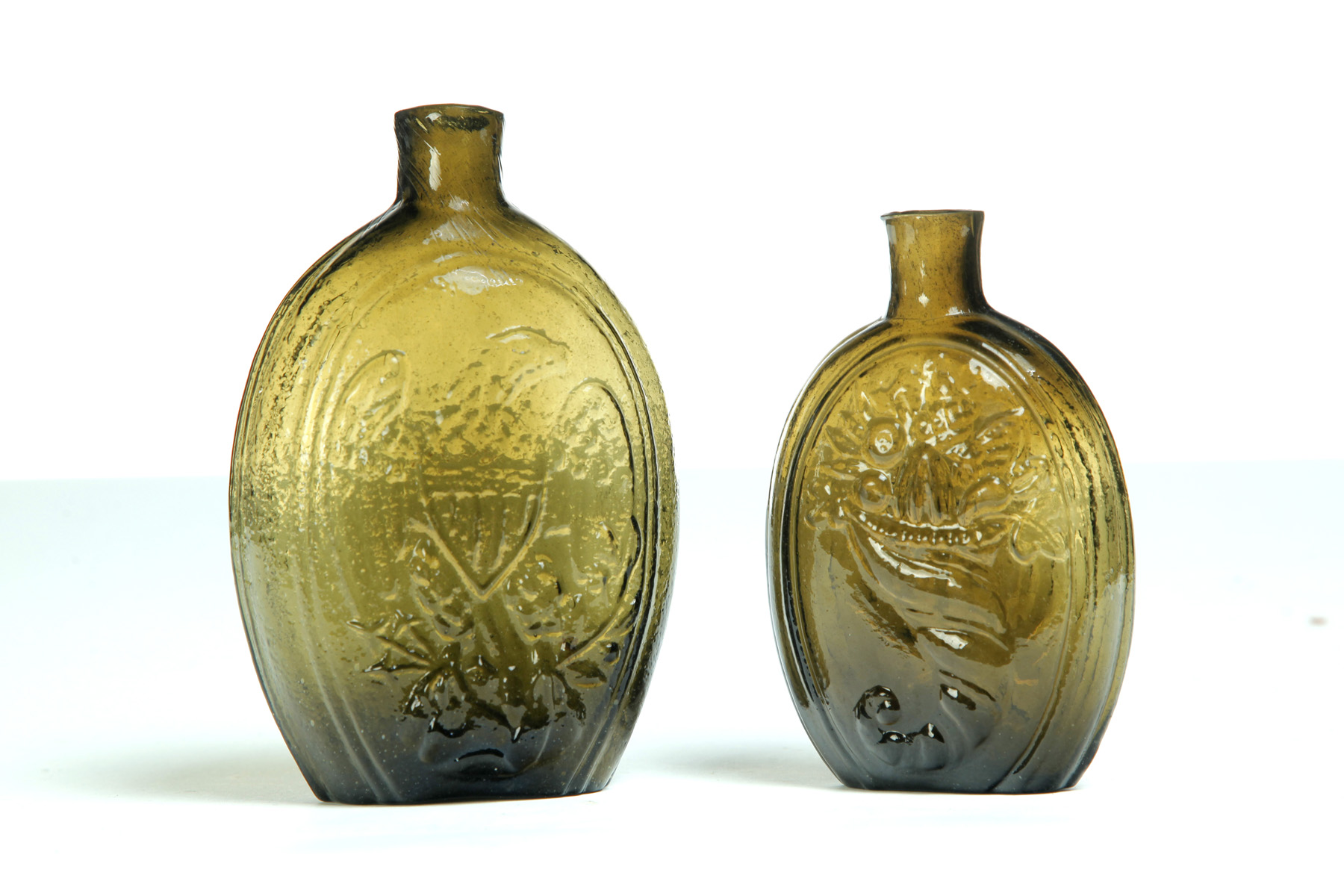 Appraisal: TWO AMERICAN GLASS FLASKS First half- th century Olive amber