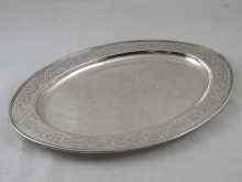 Appraisal: An oval silver dish with reeded rim and incised decoration