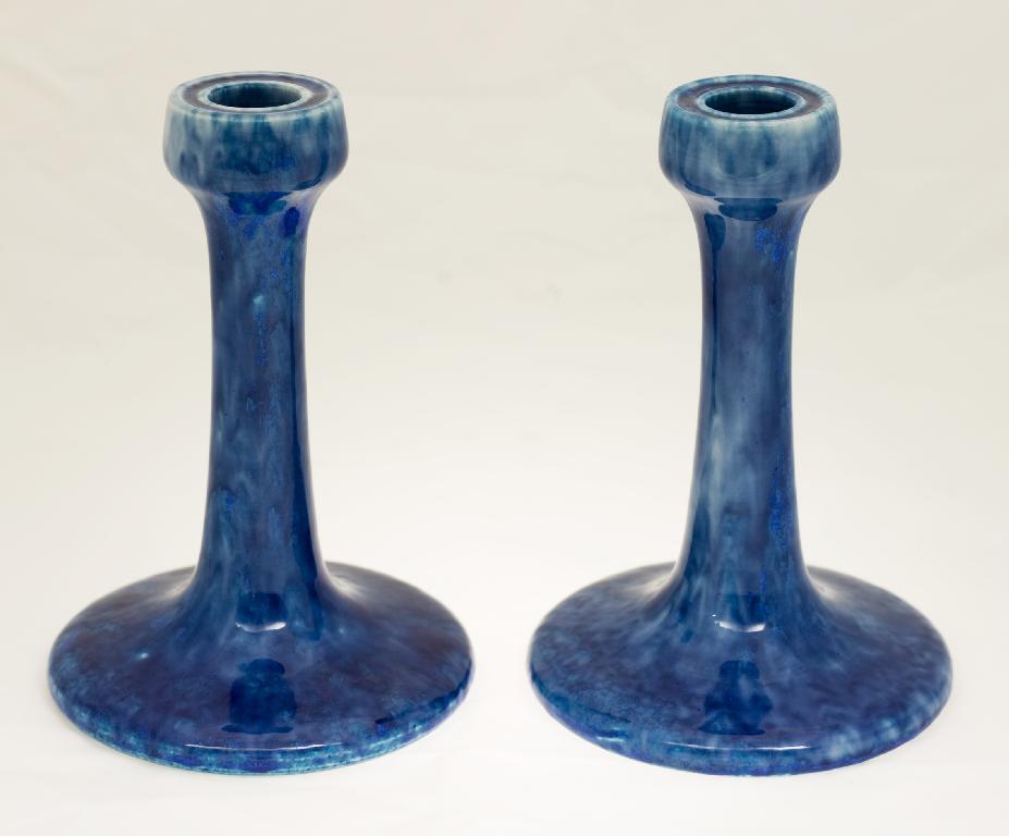 Appraisal: PAIR OF RUSKIN POTTERY CANDLESTICKS c - the circular cups