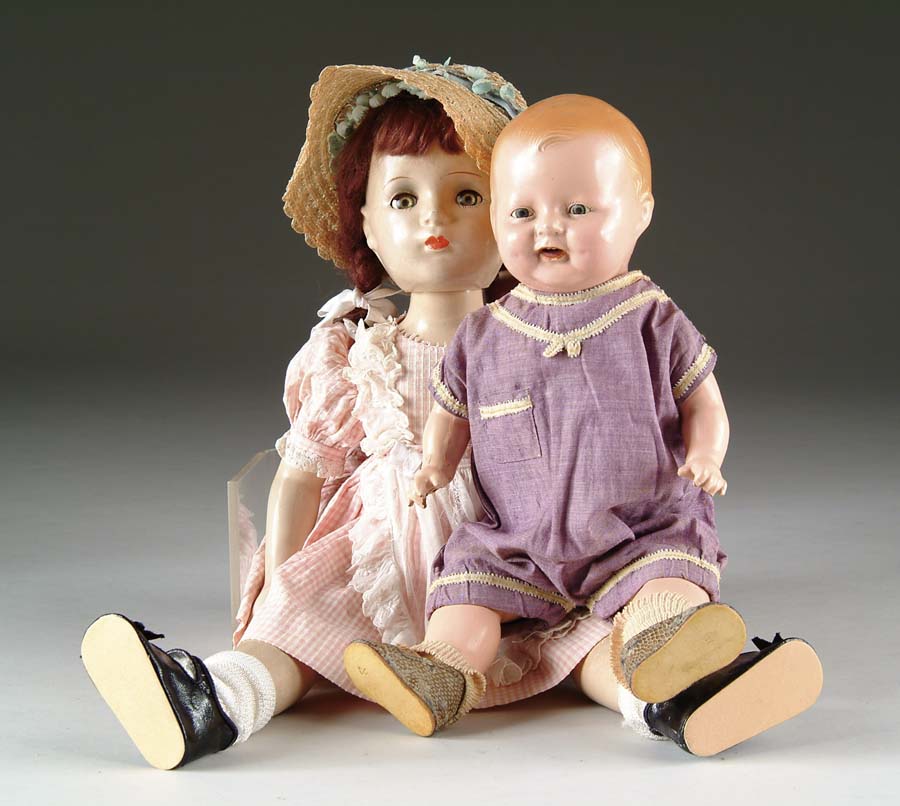 Appraisal: COMPOSITION CHUCKLES AND MADAME ALEXANDER DOLL Chuckles made by Century