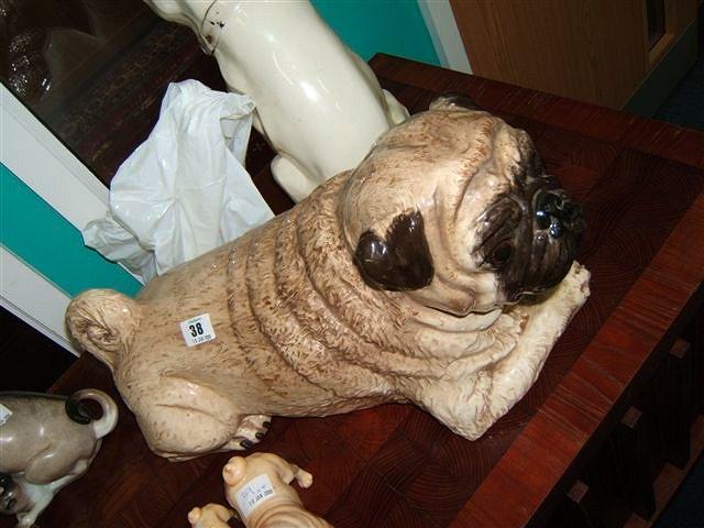 Appraisal: A glazed seated pottery pug dog signed and dated 'The