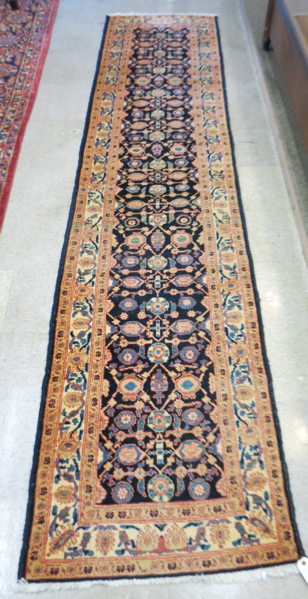 Appraisal: HAND KNOTTED PERSIAN RUNNER overall stylized floral pattern on dark