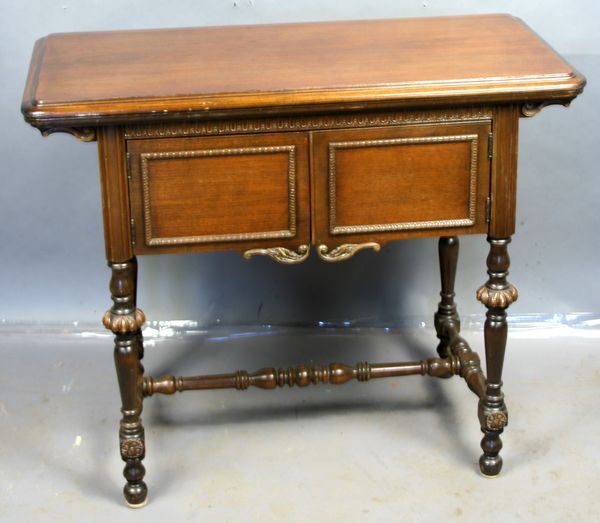 Appraisal: s walnut sewing machine cabinet with the free electric model