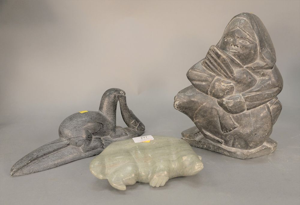 Appraisal: Three Eskimo soapstone figures seal with fish signed illegibly on