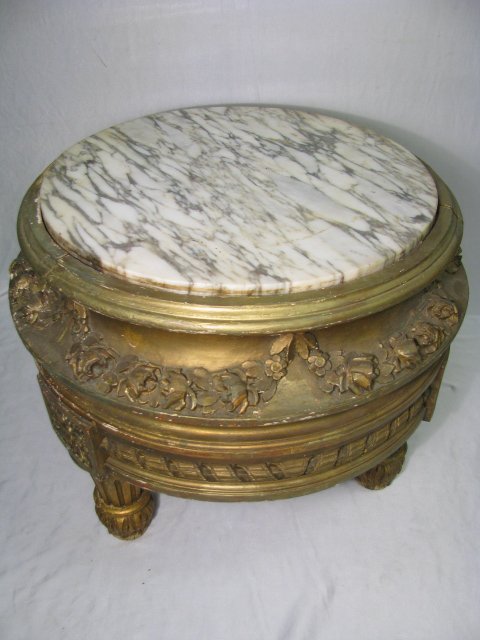 Appraisal: Round marble top table or low pedestal with carved floral