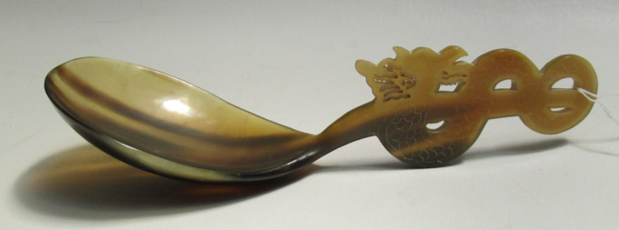 Appraisal: CHINESE CARVED OX HORN SERVING SPOON the handle a serpentine