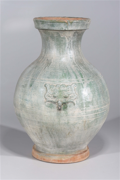 Appraisal: Chinese early style ceramic vase with molded mask handles and