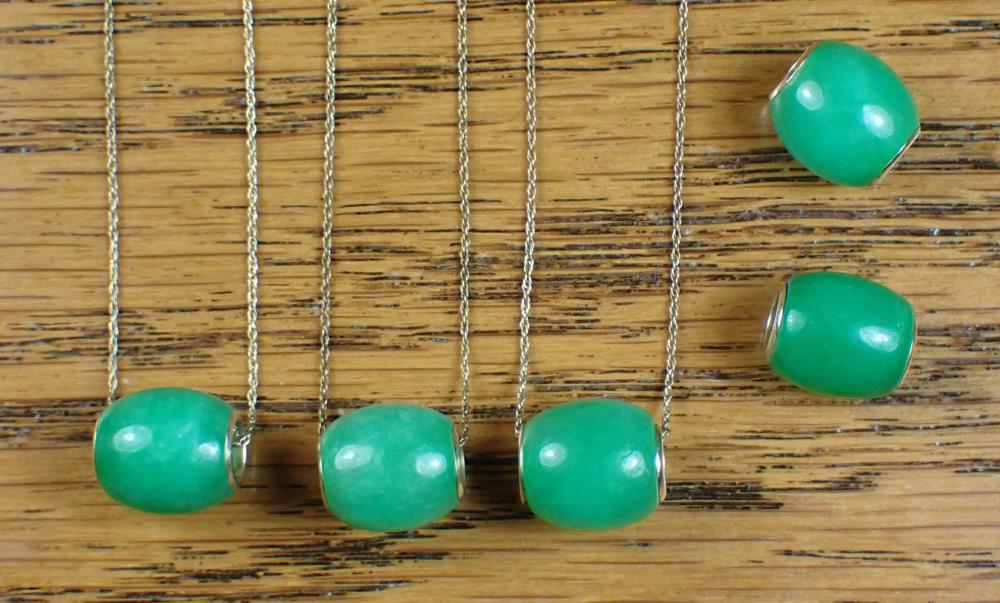 Appraisal: FIVE JADE PENDANT BEADS AND THREE GOLD ROPE CHAINS including