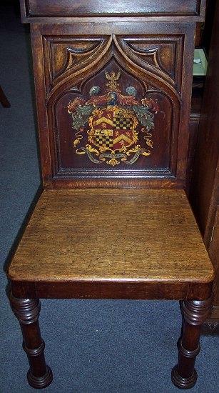 Appraisal: An early Victorian hall chair with triangular pediment to the