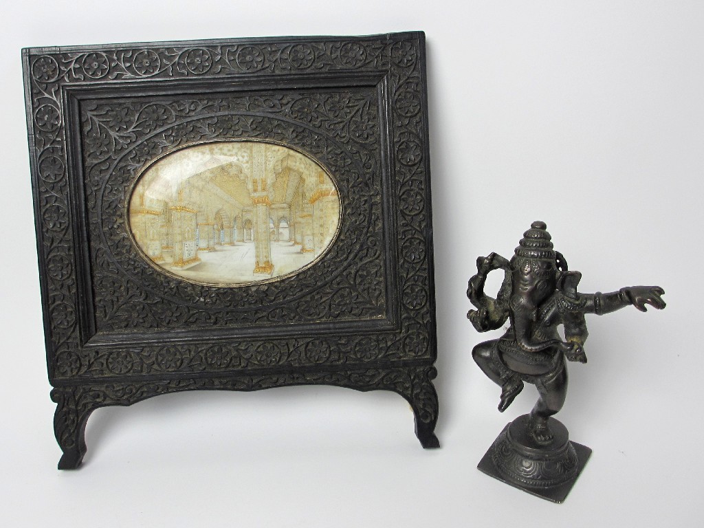 Appraisal: An Indian ivory miniature of an inner temple with carved