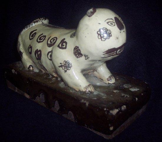 Appraisal: A Chinese chizou pottery model of a cat possibly th